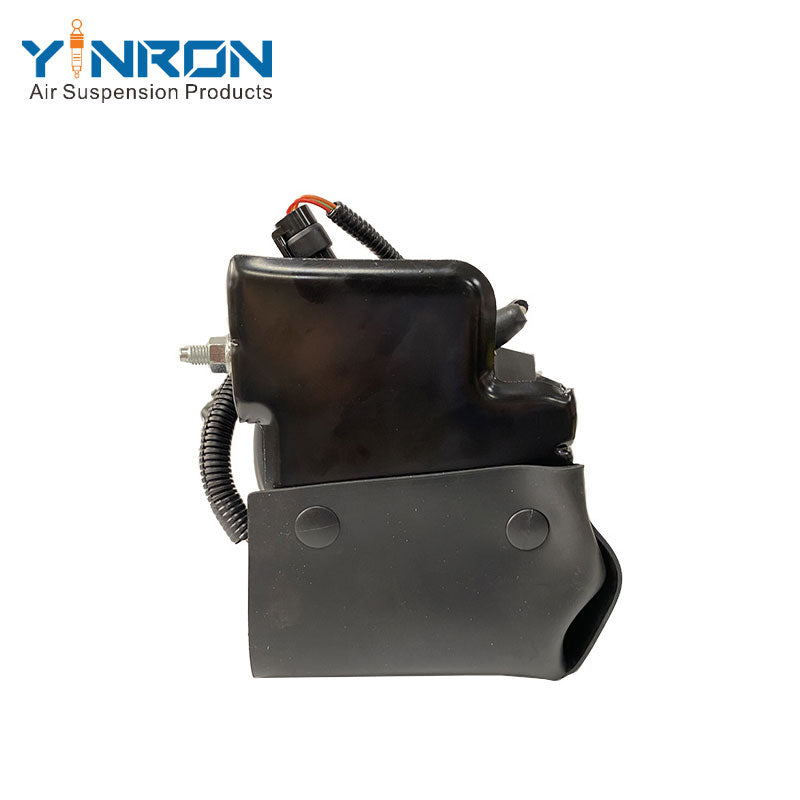 Close-up detail view of air suspension compressor pump for Cadillac Escalade II/III, Chevrolet Avalanche and GMC Yukon, OE 15254590, showing connector, relay, mounting bracket and air fitting details