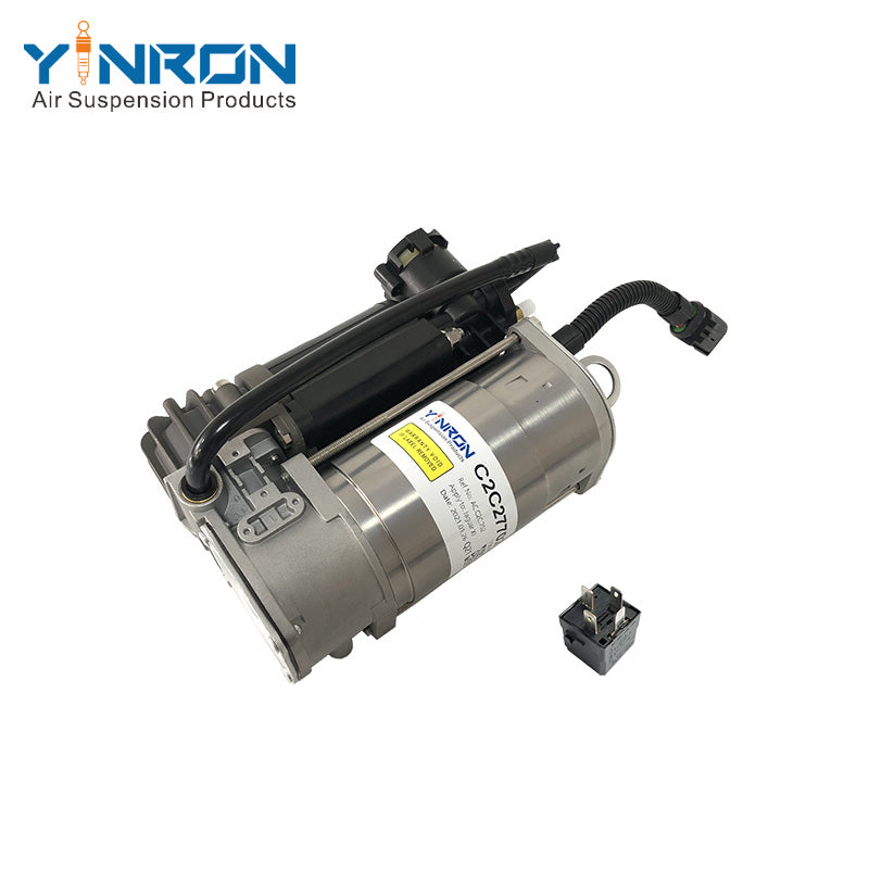 Full eye-level view of Jaguar XJ X350 air suspension compressor pump C2C27702 with relay