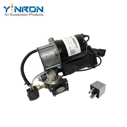 45 degree angled view of Land Rover Range Rover Vogue L322 air suspension compressor pump LR025111 with Hitachi relay