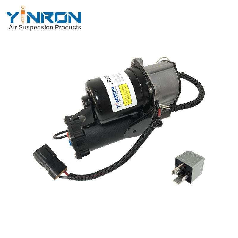 Side profile view of Land Rover Range Rover Vogue L322 air suspension compressor pump LR025111 fitted with Hitachi relay