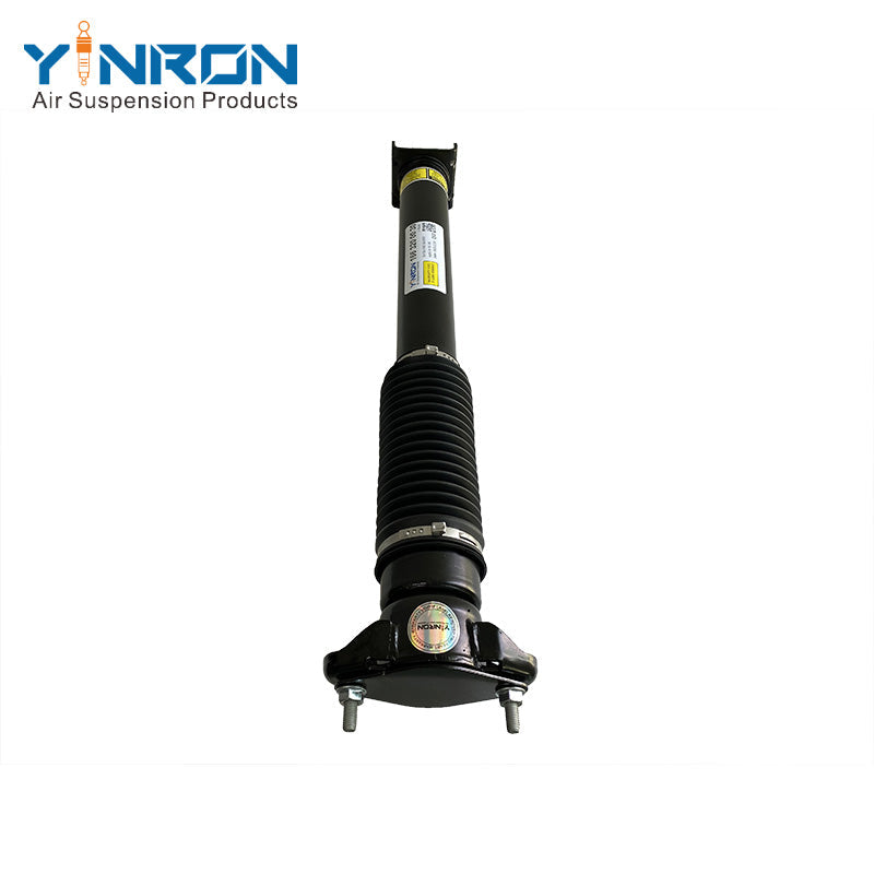 Close-up of OEM part number label A1663202431 on Mercedes rear air suspension strut.