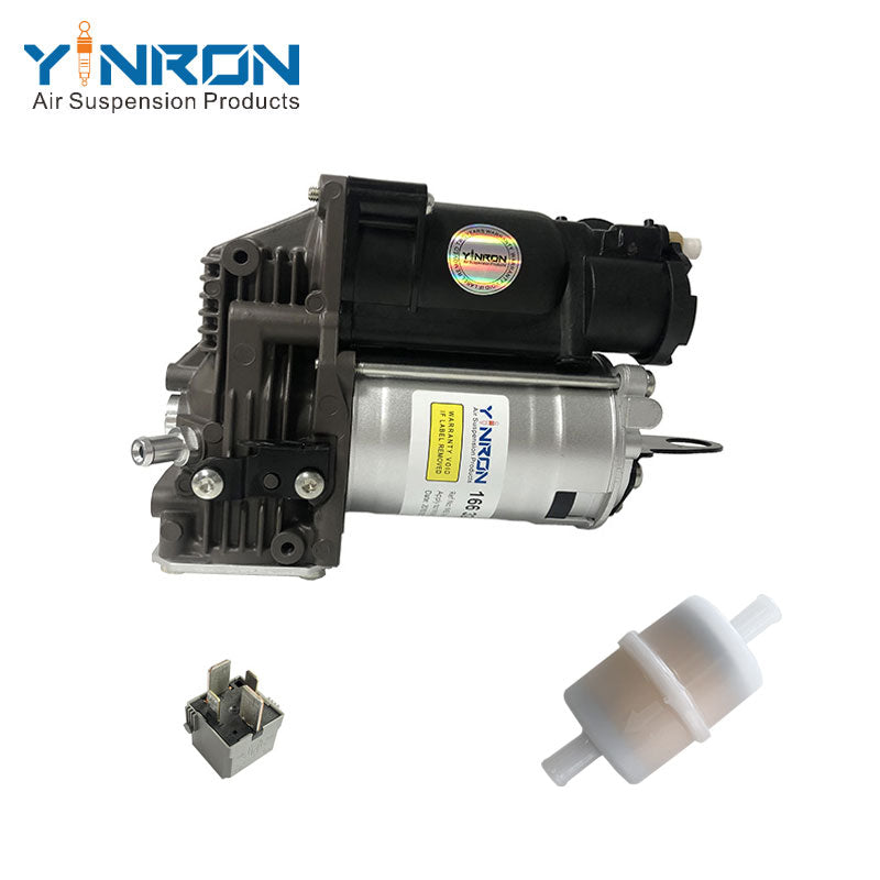 Eye-level view of Mercedes‑Benz GLE C292 air suspension compressor pump with relay and air filter (A1663200104)