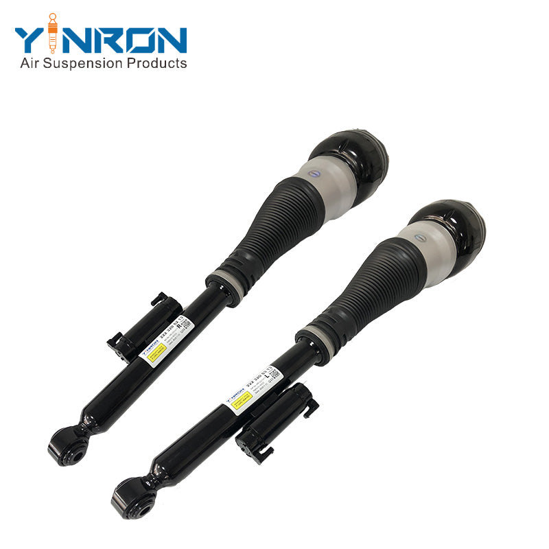 Detailed pair view showing the bottom mounting points of Mercedes-Benz S-Class W222 rear air suspension struts (A2223205213 & A2223205313)