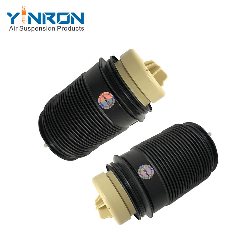 Pair side view of Mercedes E-Class W212 rear air suspension springs (A2123200725 & A2123200825)