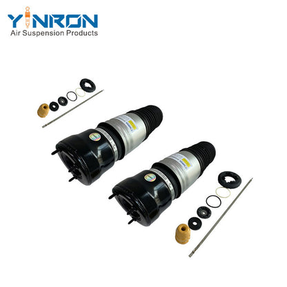 Side view of a pair of Mercedes W211 4Matic front air suspension springs (A2113209513, A2113209613), placed side by side