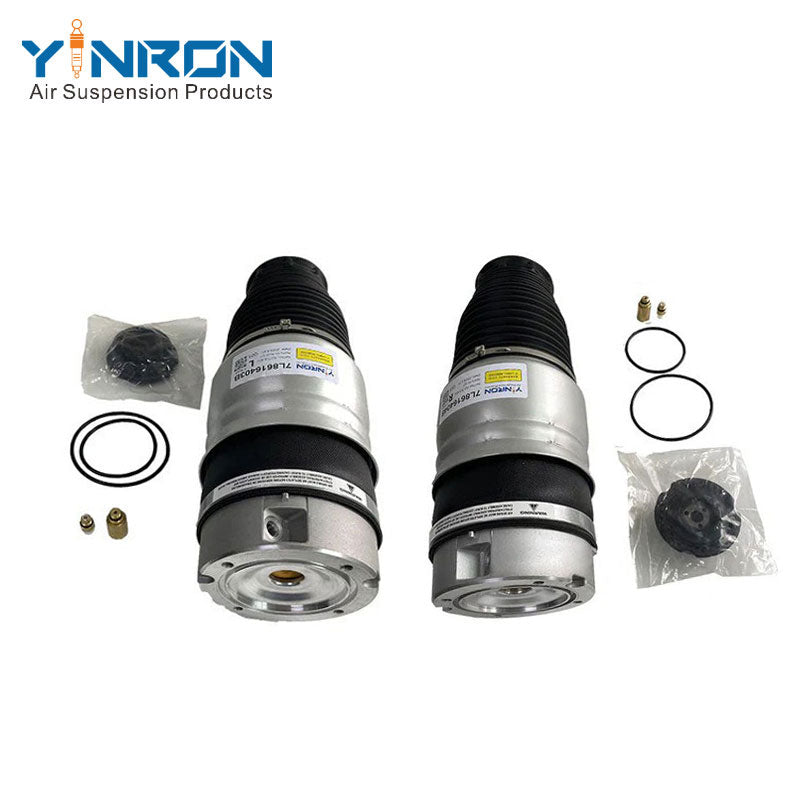 Front eye-level pair view of Porsche Cayenne 955 air suspension springs (Left 95535840300 & Right 95535840400)
