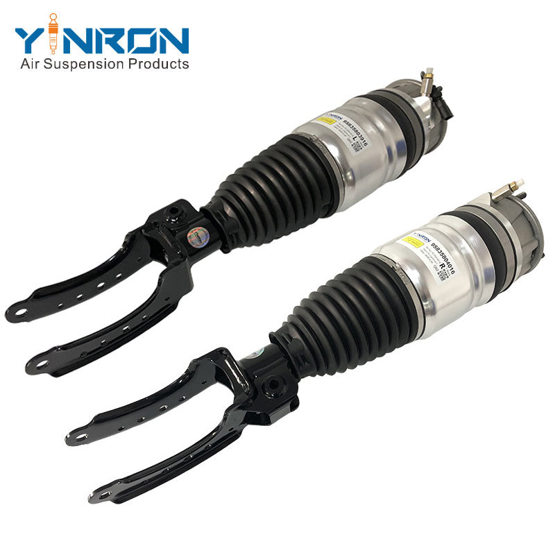 Angled perspective view of Porsche Cayenne 958 front air suspension strut pair (95835803916 & 95835804016)
