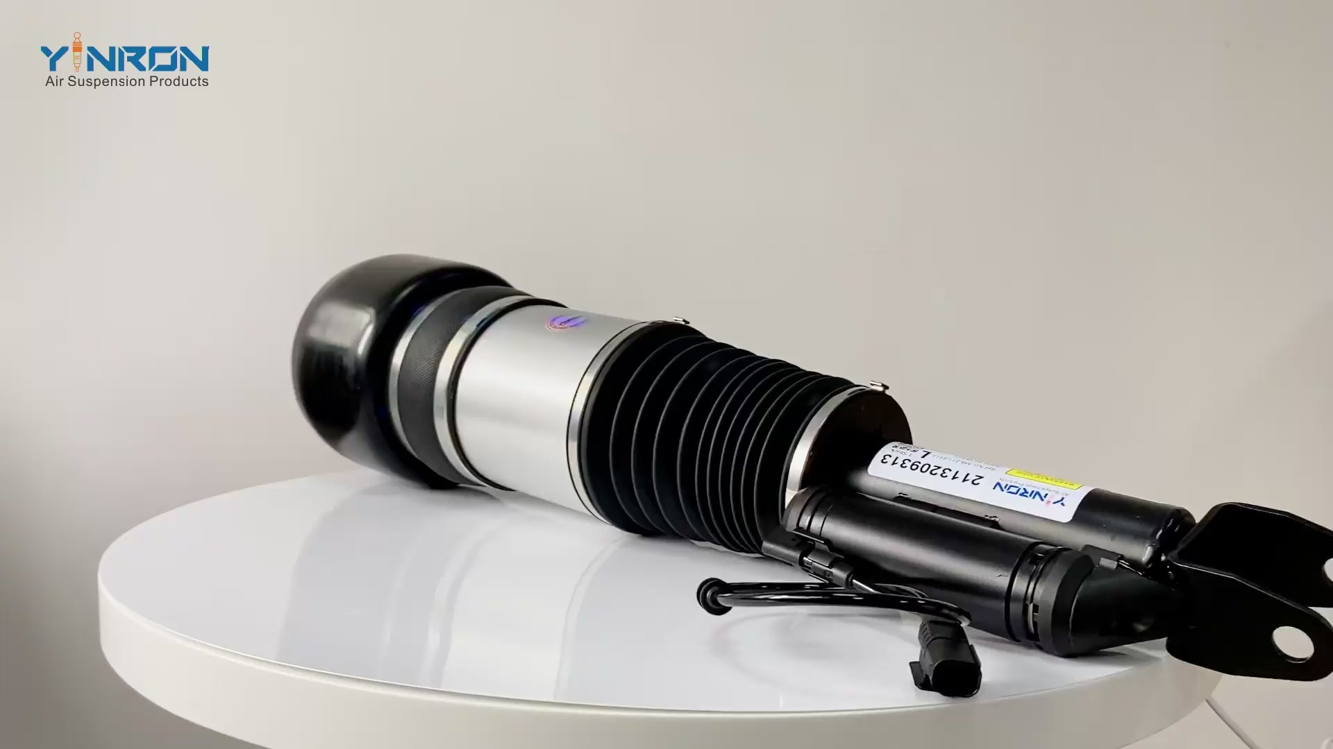 Close-up video demonstration of the premium rubber sleeve and solenoid valve on a Mercedes CLS-Class C219 air suspension strut.
