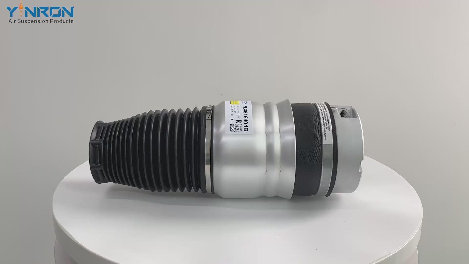 45-degree display shot of matching pair VW Touareg 7L front air springs  7L6616404B right