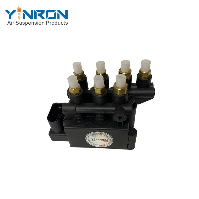 Detailed close-up view of Tesla Model S 5YJS air suspension valve block (1027919-00-B)