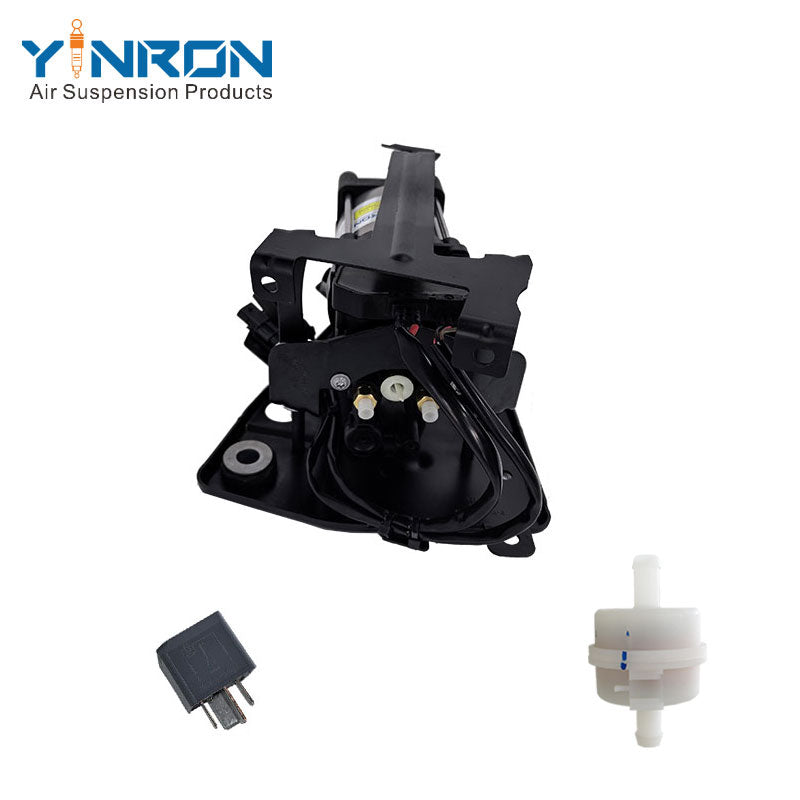 Close-up detail view of relay, air filter and interface parts on Volvo air suspension compressor pump 31360720 32315091