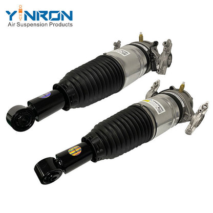 45 degree pair view of VW Touareg II 7P rear CDC air suspension struts OEM 7P6616019K & 7P6616020K